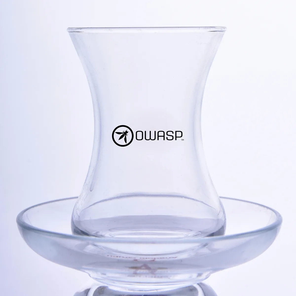 Black round icon and text logo-printed slender-waisted tea glass — Model 1002c