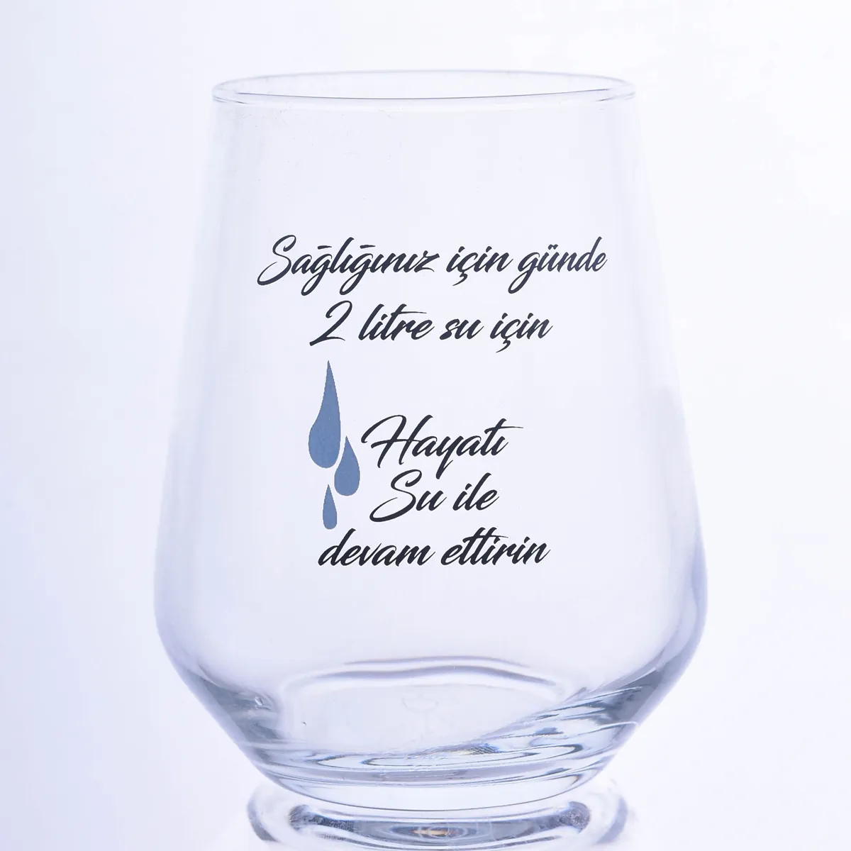 Water glass printed with black script slogan and blue drop — Model 1004c